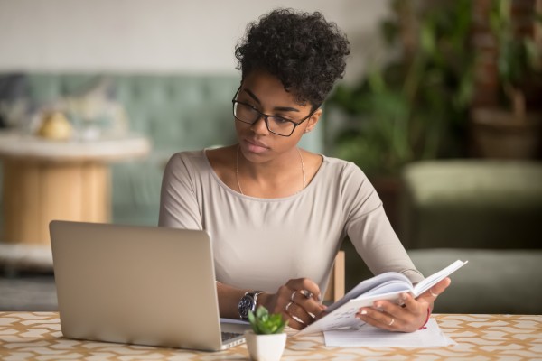 woman researching on her laptop